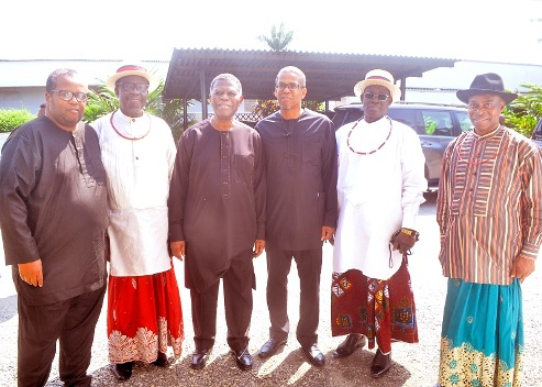 Chief Johnson Barovbe and other USCL figures during a community visit to the Dafinone family in Lagos