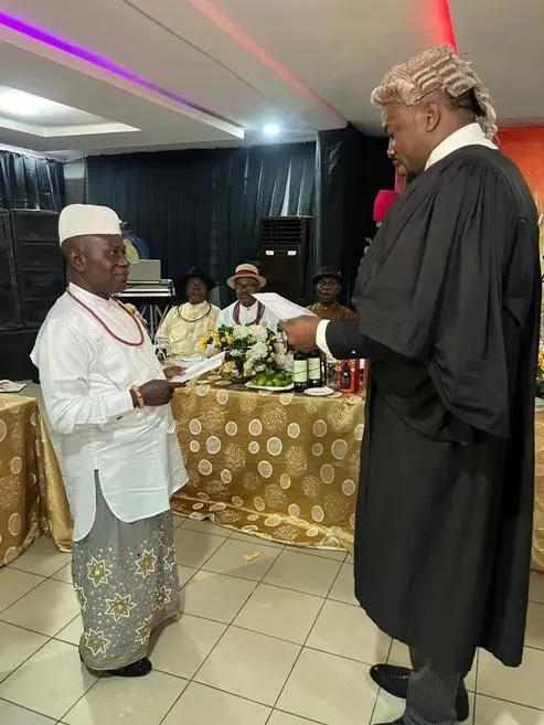 An officer being sworn into office at the August 2025 inauguration of the Urhobo Social Club Lagos executive